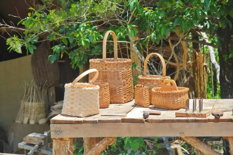 a wooden table topped with lots of baskets