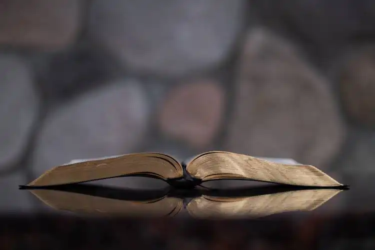 open book on glass table