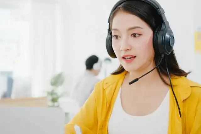 Asia businesswoman social distancing in new normal situation for virus prevention while using laptop presentation to colleagu