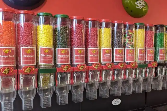 assorted candies in clear glass containers