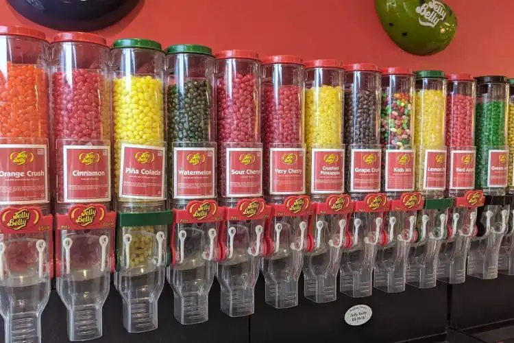 assorted candies in clear glass containers