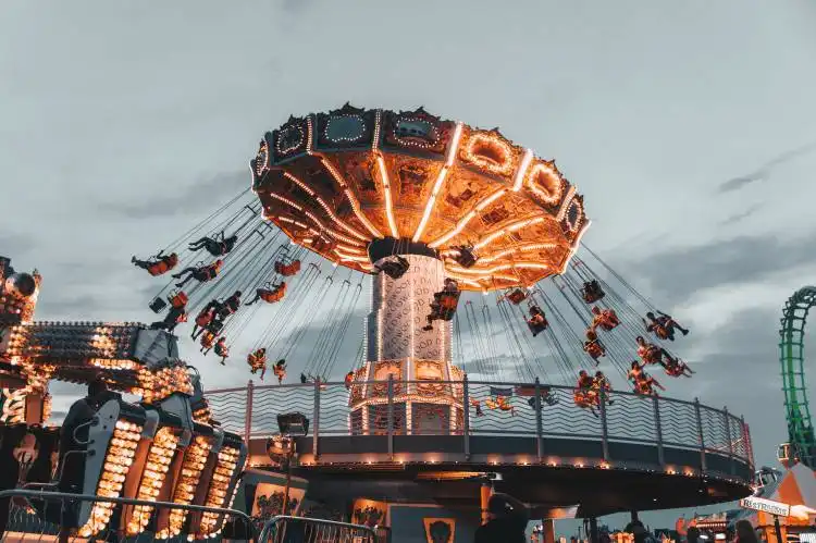people riding amusement park ride