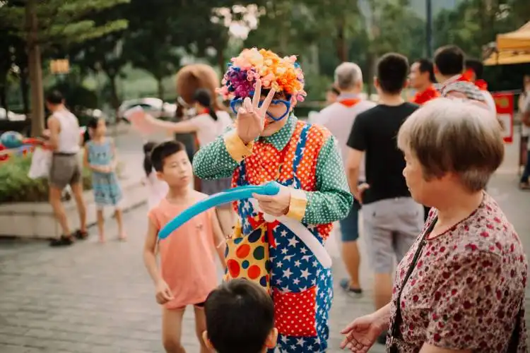 clown doing peace hand gesture