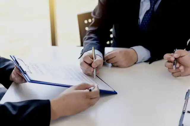 Businessman signing of investment buying and selling real estate contract.
