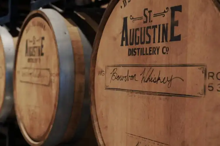 a row of wooden barrels sitting next to each other