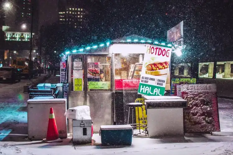 well-lighted food store during winter photo