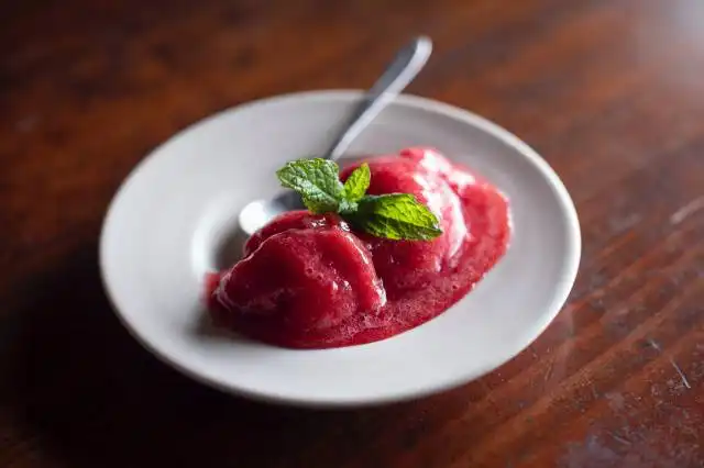 strawberry on white ceramic plate