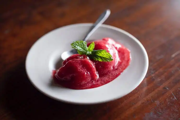 strawberry on white ceramic plate