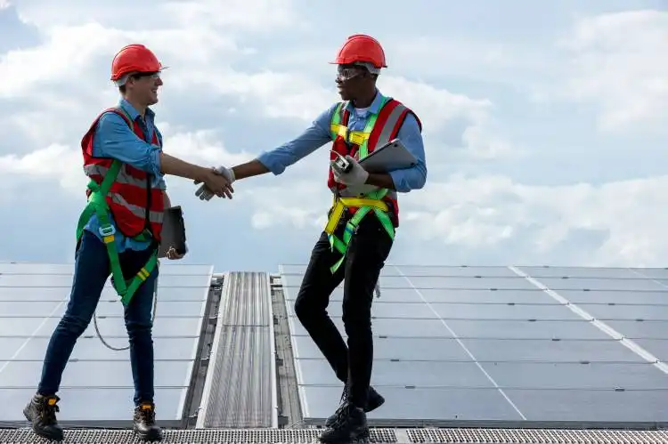 Engineer working setup Solar panel at the roof top. Engineer or worker work on solar panels or solar cells on the roof of bus