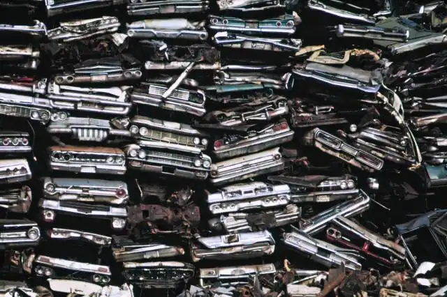 a pile of old cars sitting next to each other