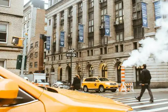 man crossing pedestrian lane