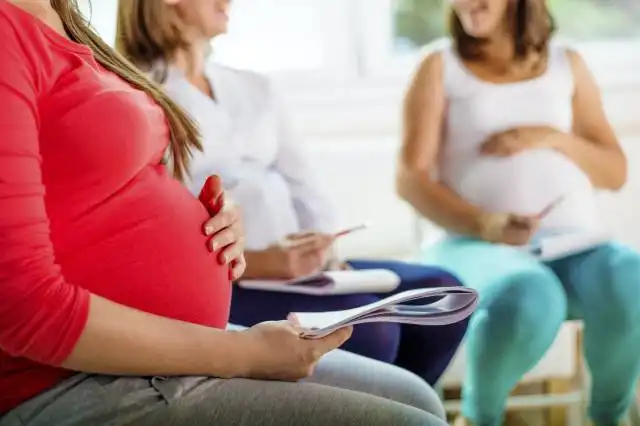 Happy pregnant women meeting at antenatal class in the hospital