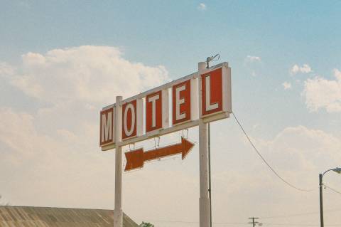 red and white motel signage