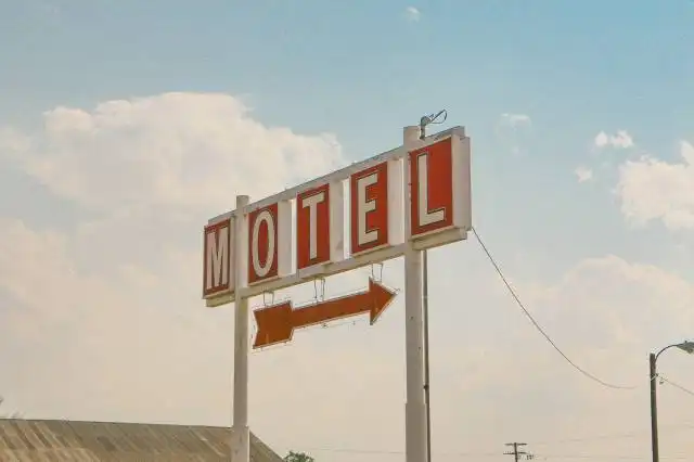 red and white motel signage