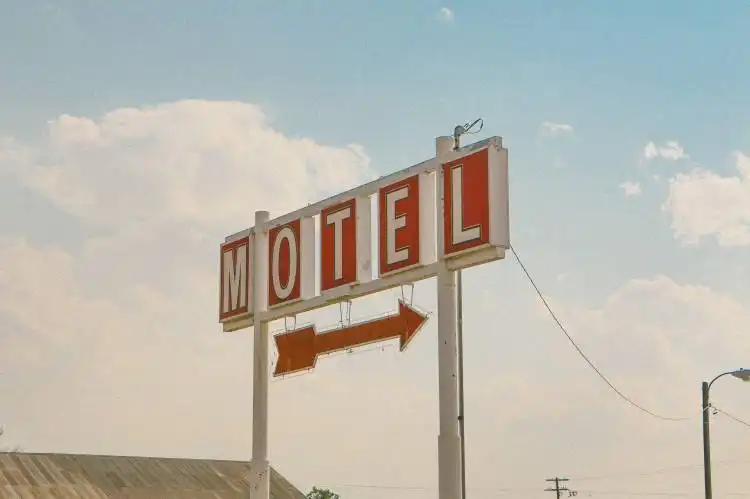 red and white motel signage