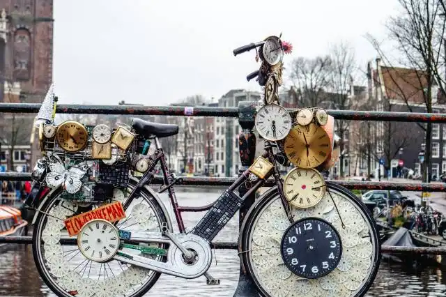 red and black motorcycle with brown and white round analog clock