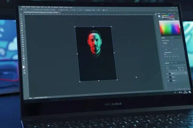 black lenovo laptop computer turned on displaying man in red shirt