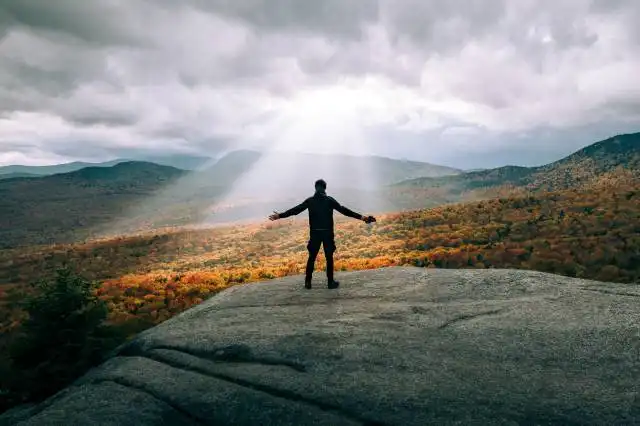 a person standing on a hill