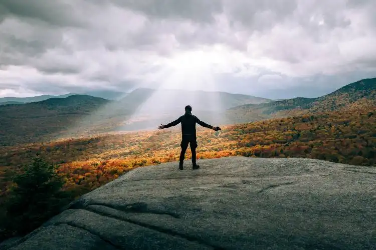 a person standing on a hill