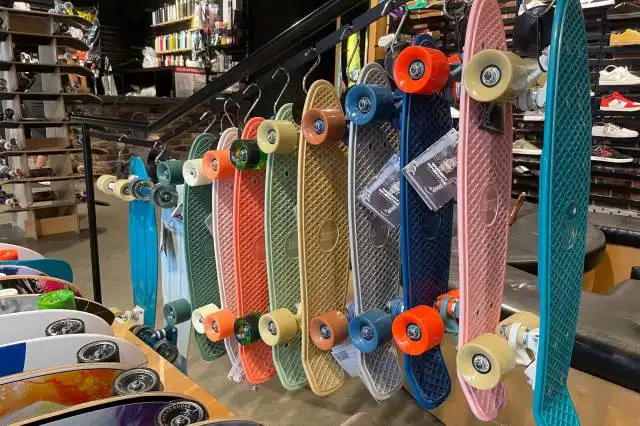 a row of skateboards on display in a store