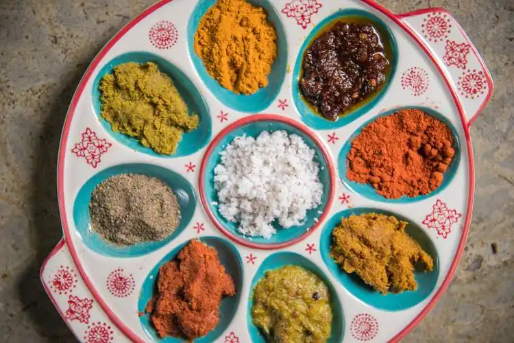 a plate with a variety of spices on it