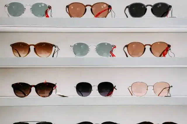 black framed sunglasses on white surface