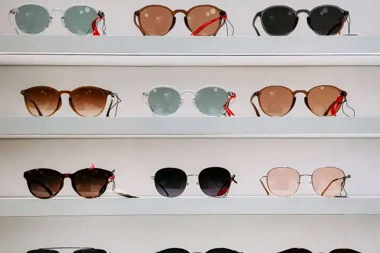 black framed sunglasses on white surface