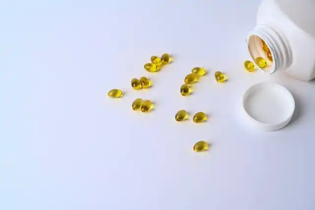 Fish oil capsules isolated on white background.