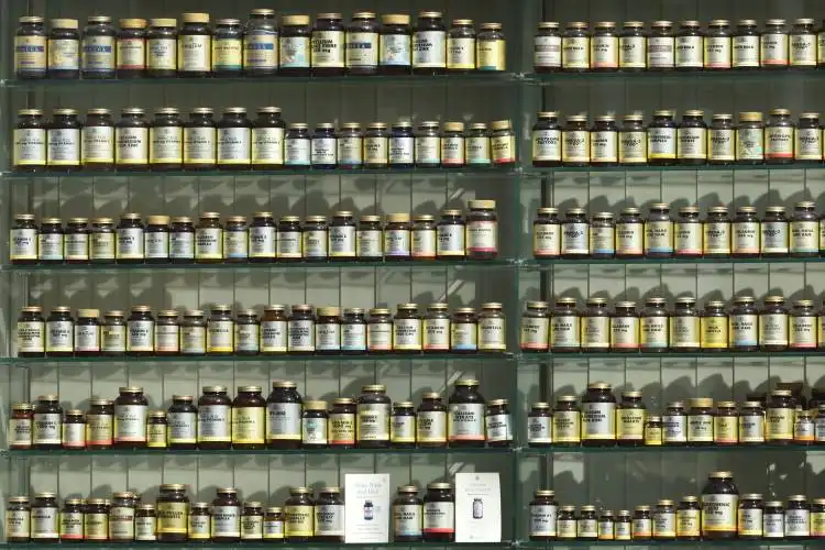 assorted labeled bottle on display shelf