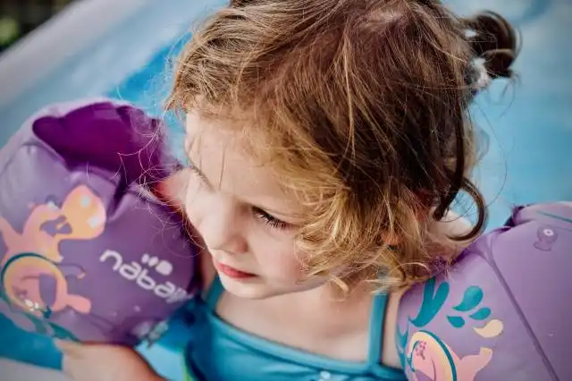 girl in above the ground pool