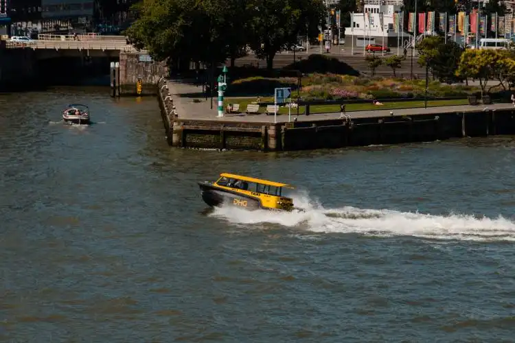 yellow and black boat on body of water