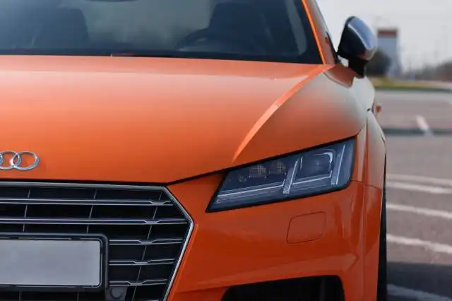 orange Audi vehicle