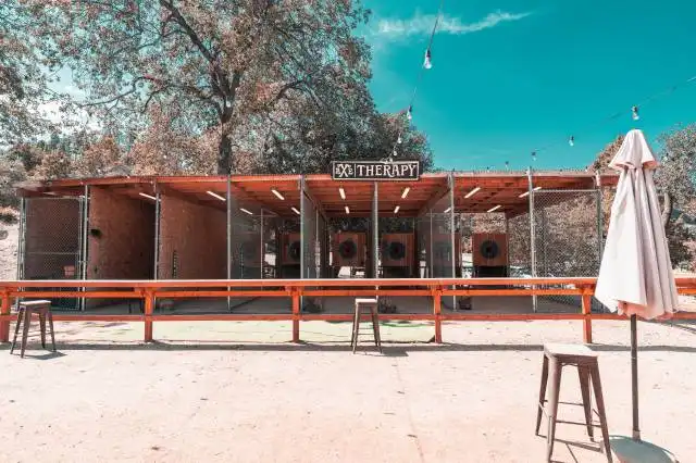 a building with a sign and umbrella