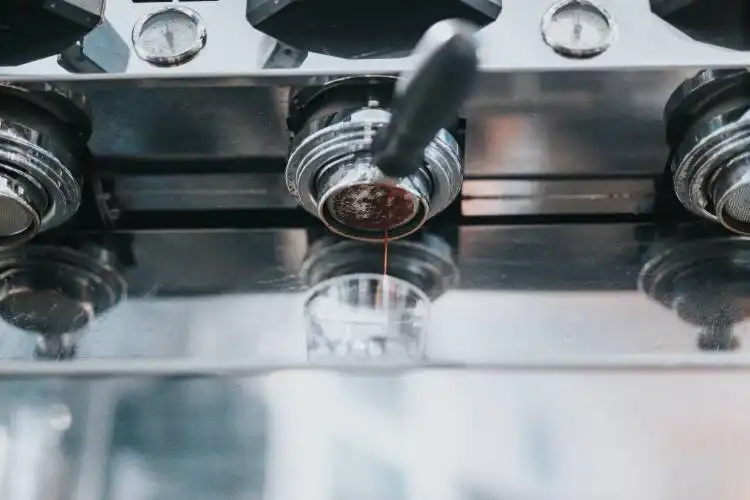 a close up of a machine that has some liquid in it